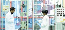 Postgraduate students carrying out gas adsorption analysis